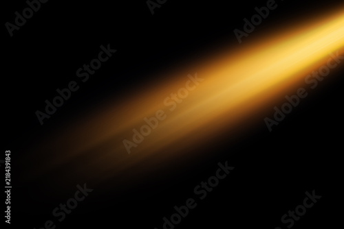 Abstract golden light streak on a dark background