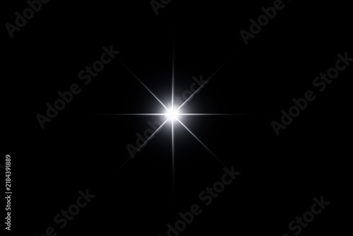 A brilliant white starburst shining in a dark background.