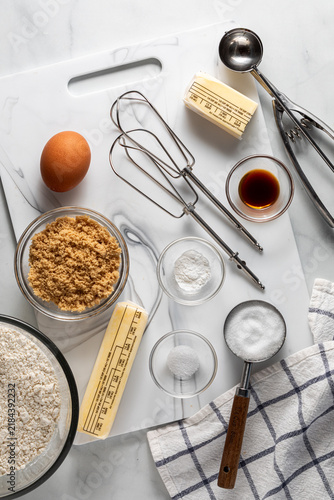 Various ingredients and tools used for making pie dough.