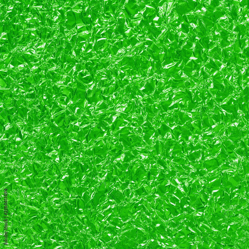 Fototapeta premium Green lime foil shiny texture, abstract wrapping paper for background and design art work.