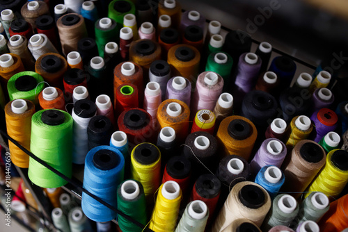Canvastavla Colorful Sewing Threads Spools Displayed on Shelves in Textile and Garment Suppl