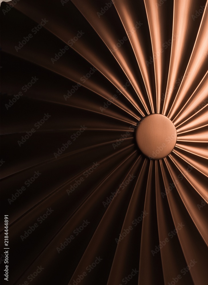 Obraz premium Bronze metallic turbine with radial pattern design