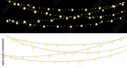 Glowing string lights hanging against black