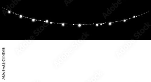Glowing string lights hanging against a dark background