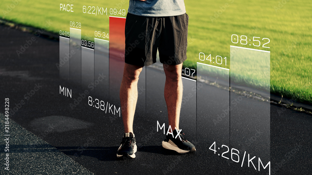 Obraz premium Sports performance data displayed on a track with a person standing nearby during a training session
