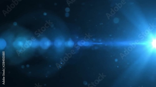 Bright blue glowing light burst with lens flare and soft rays on a dark space-like background, creating an abstract futuristic energy scene.