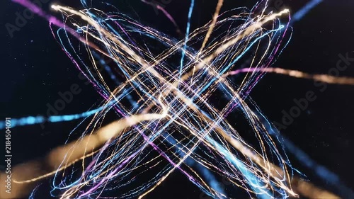 Abstract long exposure light trails crossing in blue, pink, gold and white against a dark black background, creating a glowing energetic pattern.