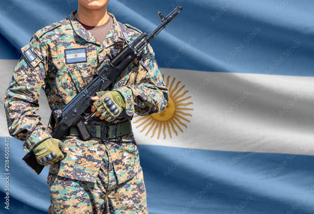 Obraz premium Argentina flag with soldier holding assault rifle