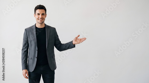 Professional man presenting empty space for your advertisement text, business, male, gesture, marketing, corporate