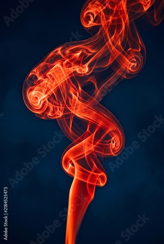 Swirling Orange Smoke Against a Dark Blue Background