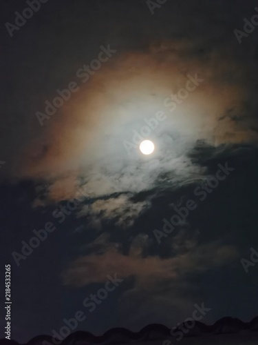 Photography full moon over the clouds