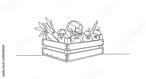Wooden crate filled with assorted fresh vegetables