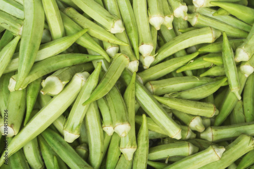Fresh okra vegetables close up as background	