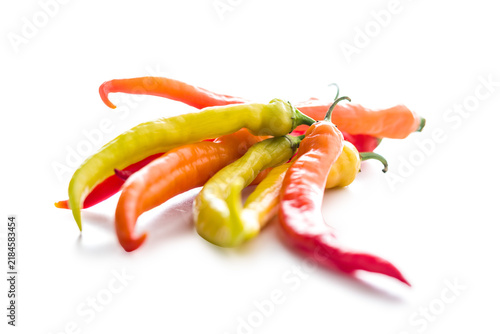 Colorful Red And Yellow Chili Peppers On White Background For Spicy Food And Cooking