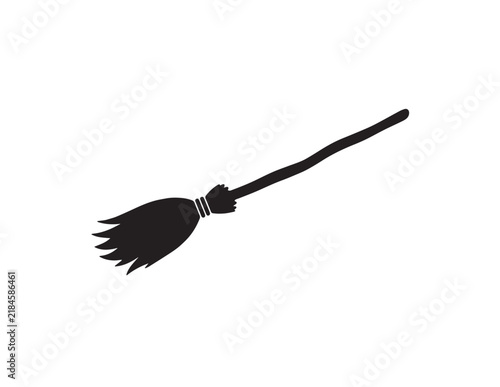 Fotografie Simple black silhouette of a witch broomstick for magical Halloween party graphi