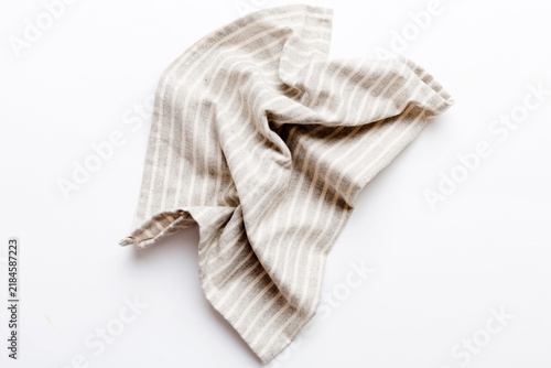 Konstfotografi top view with gray kitchen napkin isolated on table background