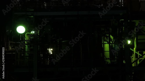 Dark Industrial Piping and Machinery Under Green Lights at Night in Chidoricho Kawasaki