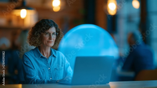 Woman working on laptop in cozy cafe