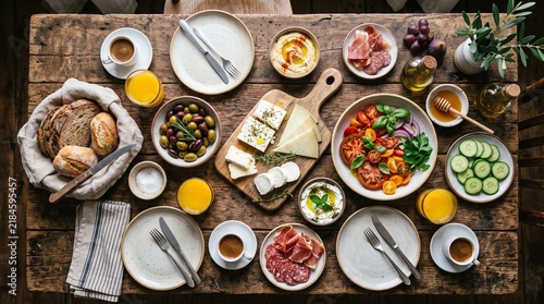 Top view rustic Italian breakfast table with bread cheese and salad