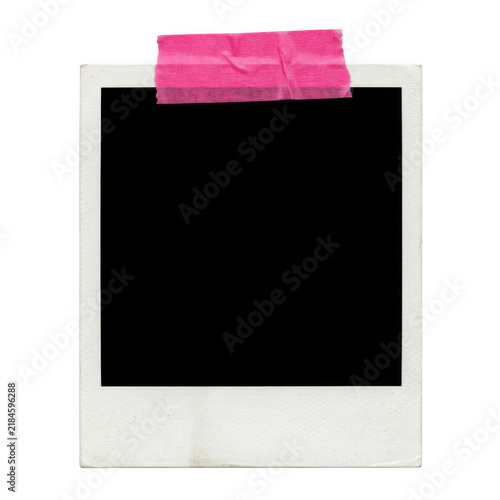 Empty vintage polaroid photo frame with a pink tape strip