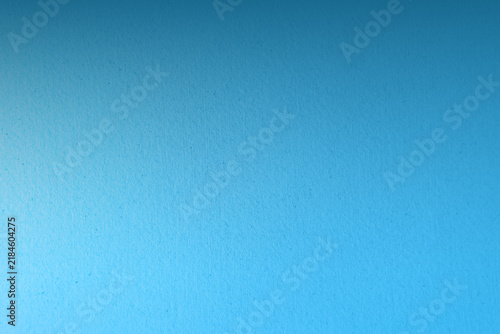 Calm light blue sky tone color paint on recycled rough paper texture background with space minimal style 