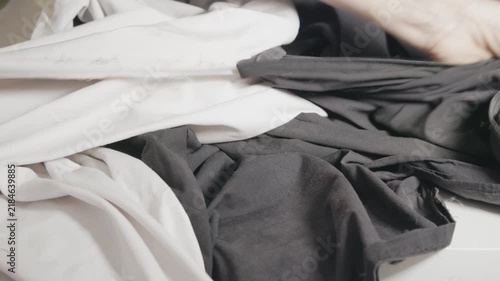 Tailor at work ripping used fabric