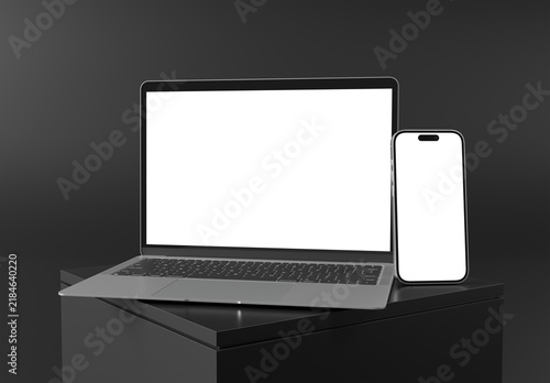 Plakat w ramie Modern smartphone and laptop with blank screens isolated on black background, side view, 3D rendering