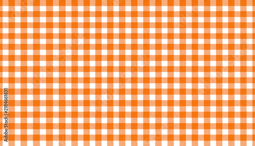 Classic orange and white gingham checkered fabric pattern texture background