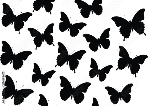 Collection of butterfly silhouettes in various flying poses, elegant black insect set isolated on white background, nature design element for decorative artwork