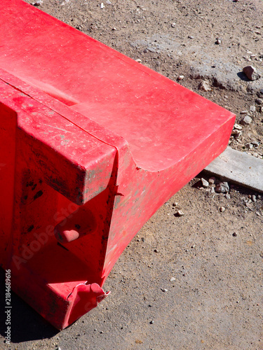 Obraz na płótnie Close view of a red plastic road barrier used for traffic control and temporary