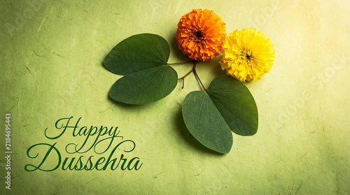 Happy Dussehra Greeting Card with Marigold Flowers and Green Leaves