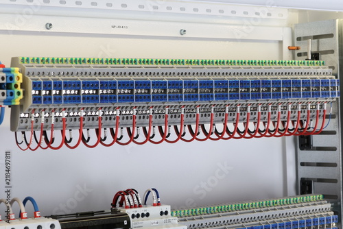 Electrical screw terminals for connecting copper electrical wires with metal lugs in electrical switchboard. 