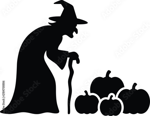 Fotografie Black silhouette of a spooky witch with pumpkins for Halloween