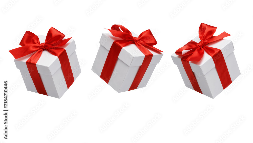 Fototapeta premium Three white gift boxes with red ribbon bows, isolated on transparent background