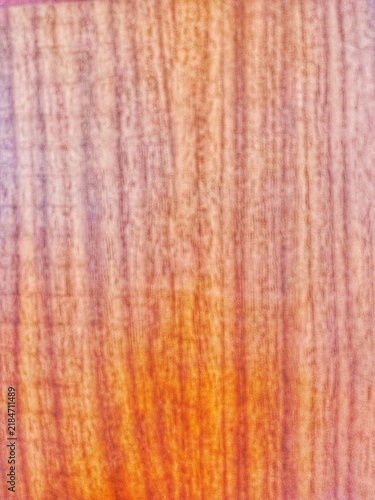 This photo shows a wooden board with a clearly visible natural wood grain texture on its surface. 
