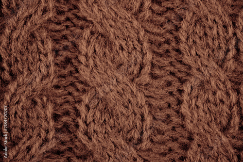 Obraz na płótnie Brown knitted textile texture with cable knit pattern