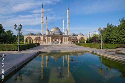 The Heart of Chechnya mosque with a reflection on a sunny June morning. Grozny, Chechen Republic