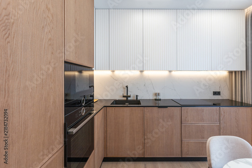 Details of modern design trendy kitchen sink with water tap faucet