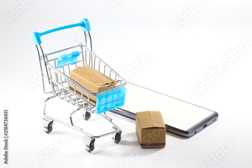 Black Friday online shopping concept with cart, package and mobile phone
