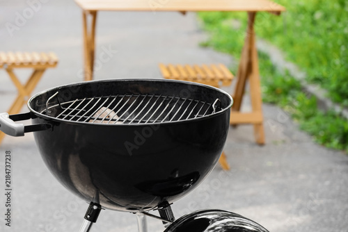 Naklejka Modern brazier in forest, closeup
