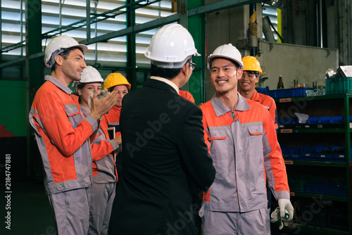The engineer checks the parts coming out of the machine.