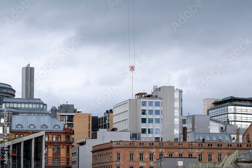 Overcast skyline of Oslo Norway shows a layered urban panorama with varied buildings towers and rooftops beneath a grey northern sky