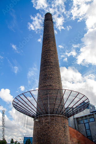 Принти на полотні The historic brick chimney of Kultuurikatel creative hub, a converted former power station building in Tallinn, Estonia, rising into a cloudy blue sky