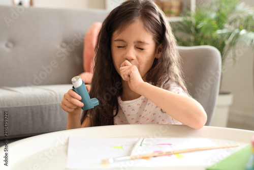 Konstfotografi Little girl with inhaler having asthma attack at home, closeup