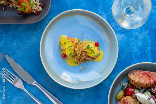 Quadro su tela Deliciously Crafted Gourmet Dish Served on a Colorful Dining Table