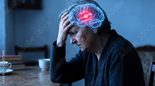 Elderly woman suffering from intense chronic migraine headache with glowing digital brain inflammation medical illustration overlay