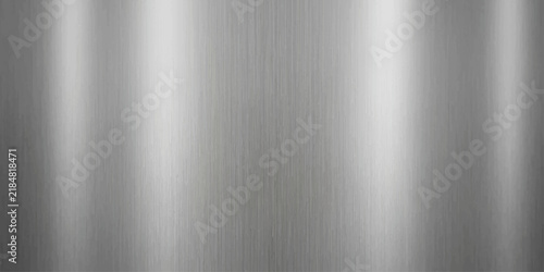 Luxury silver and silver brushed metallic metal surface background. The satin surface shifts from bright core to darker edge.