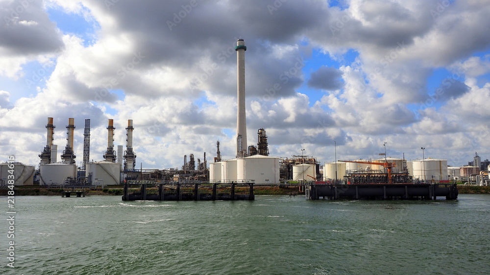 Fototapeta premium Oil Refinery, Storage Tanks and Industrial Waterfront at the Port of Rotterdam, Netherlands