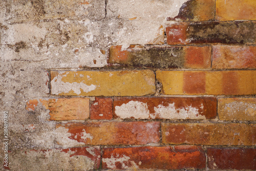 Old damaged brick wall background