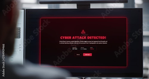 Professional IT Specialist Monitoring Dual Displays as Cyber Attack is Resolved, Emphasizing System Recovery, Secure Operations, Digital Resilience, and Protection of Critical Infrastructure.